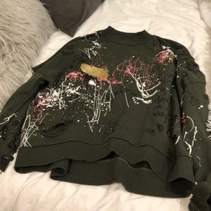 splattered, ripped up sweatshirt